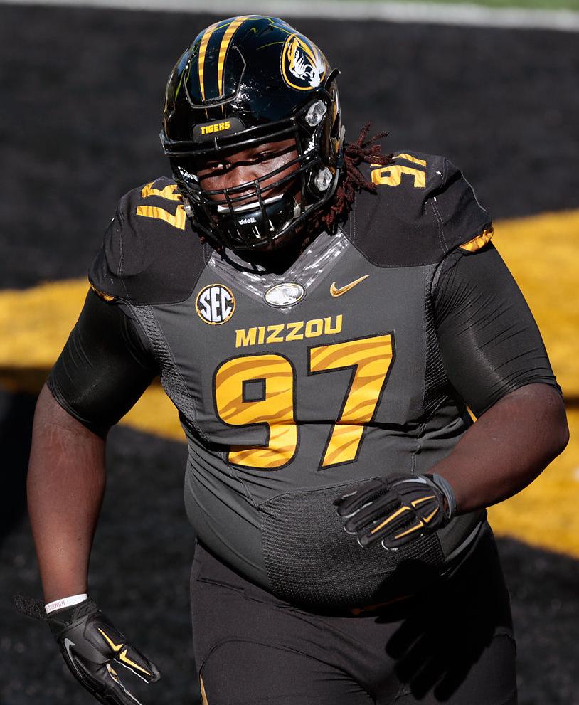 Josh Augusta warms up before a game